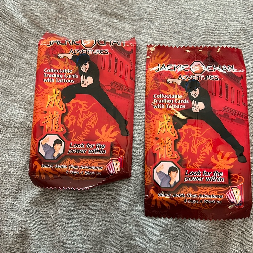 2 unopened packages of Jackie Chan adventures ranging cards.